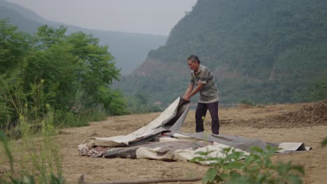 rural farmer preparing covering