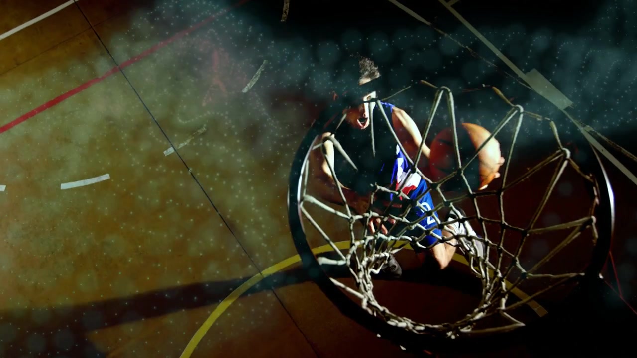 Giocatore di basket che palleggia in alto a sinistra, che inizia una penetrazione verso il canestro, salta e segna per finire