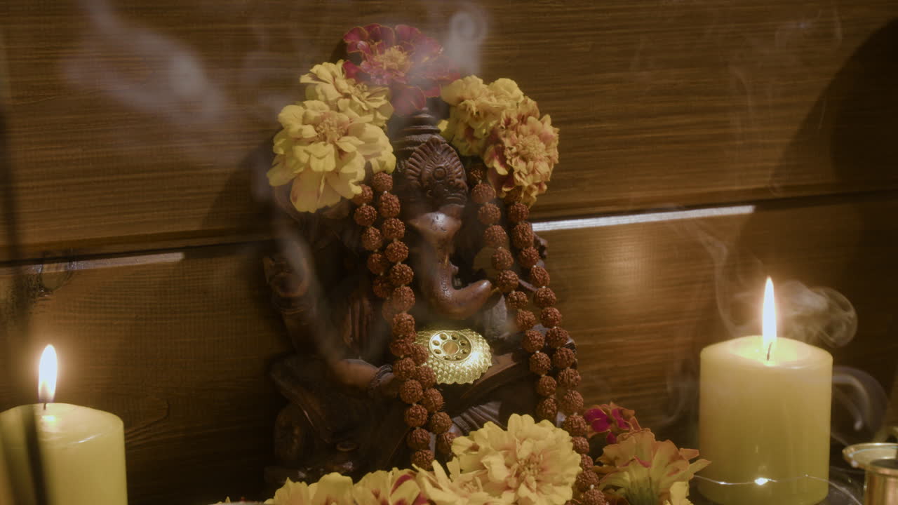 Ganesha Statue with Incense and Candles