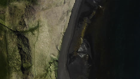 aerial - rugged coastline, hvitserkur,vatnsnes, iceland, top down spinning shot