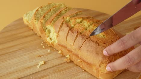 a loaf of cake being sliced