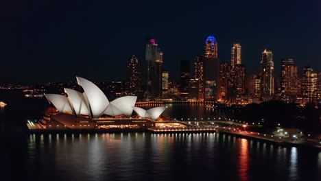 sydney opera house and skyline at night