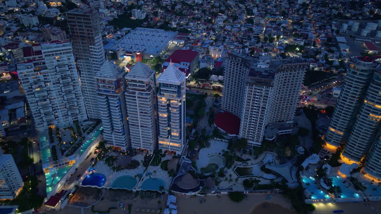 Drone lift-off capturing Acapulco’s hotel area at night