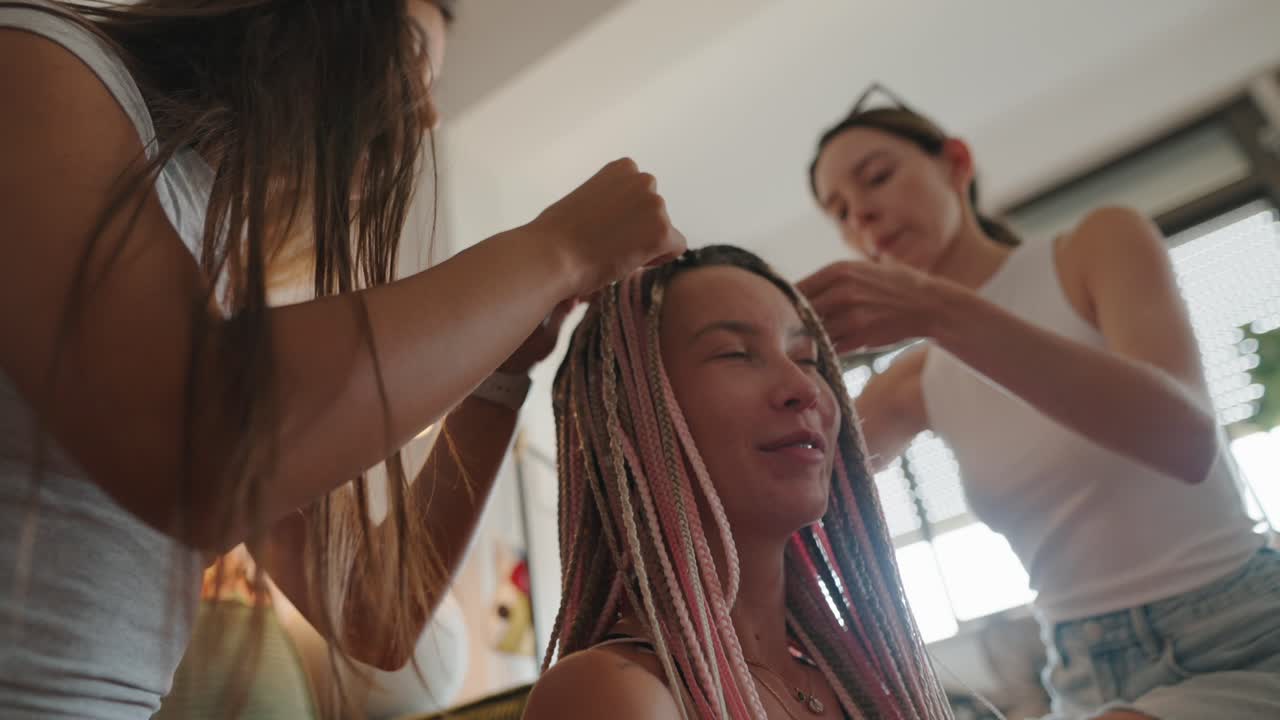 Women getting braids hairstyle