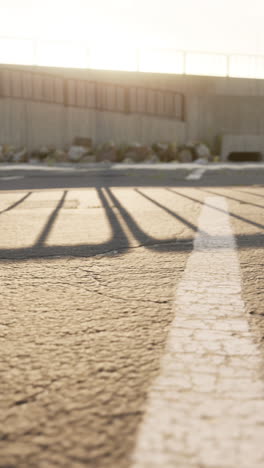 shadow of a fence on a street