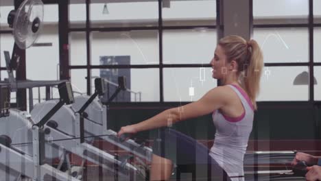 Animation-of-multiple-graphs-over-caucasian-couple-doing-seated-cable-rows-in-gym