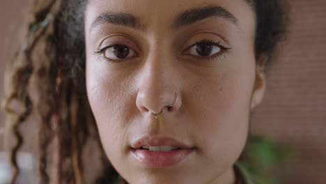 close up portrait of attractive mixed race woman face looking serious pensive at camera independent woman focused intense