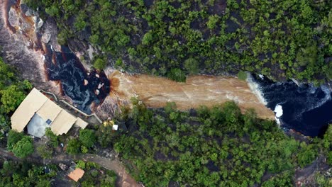 Aerial-drone-bird's-eye-rising-wide-shot-of-the-Mucugezinho-River-with-a-small-incline-waterfall-leading-to-a-natural-pool-near-the-Devil's-Pit-in-the-Chapada-Diamantina-National-Park-in-Brazil