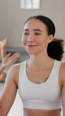 group of women practicing yoga and meditation in a studio