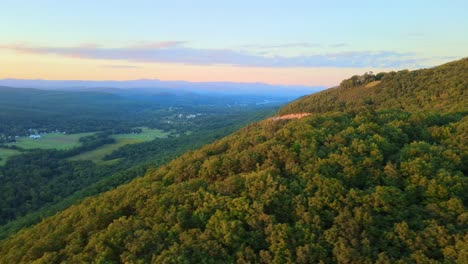 beautiful aerial drone video footage of late summer and early fall in an appalachian mountain valley with forests and rolling green hills