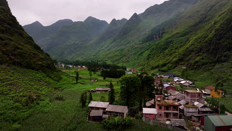 natural scenery in mountains village, ma pi leng pass through ha giang loop, drone shot