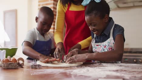 african american mother and her children in the kitchen