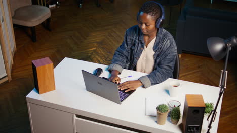 woman working on laptop at home