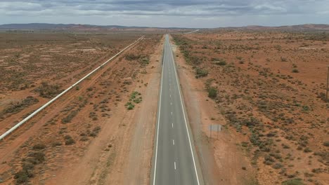 flying high above and outback road as a truck passing by