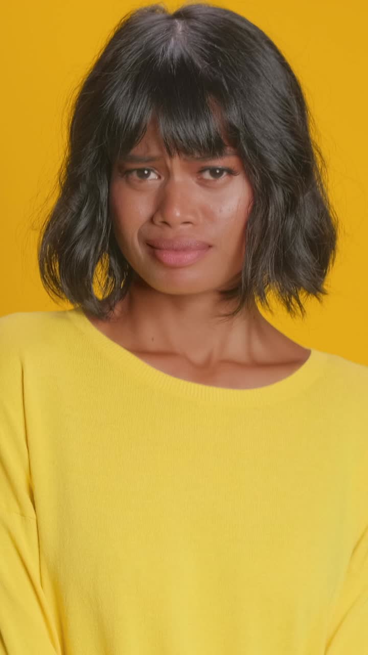 Expressing joy and contentment in a vibrant yellow setting