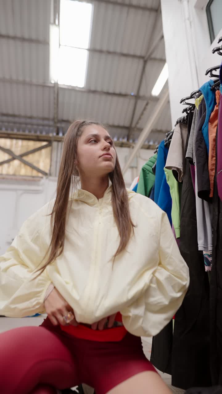 Woman Trying On Clothes In Changing Room