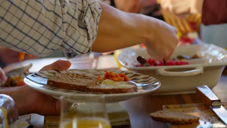 Family-having-food-on-dining-table-4k