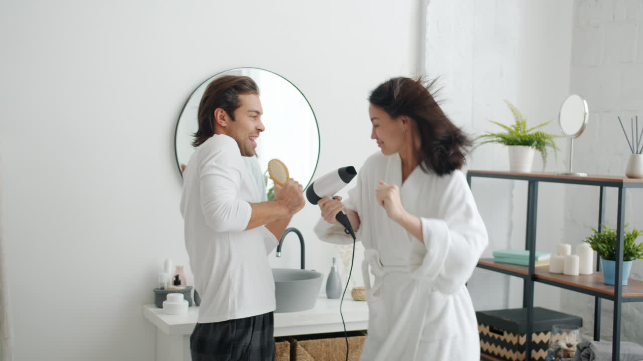 Couple Singing and Dancing in Bathroom