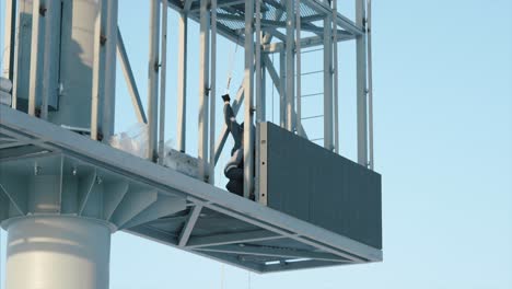 worker installing a large led billboard