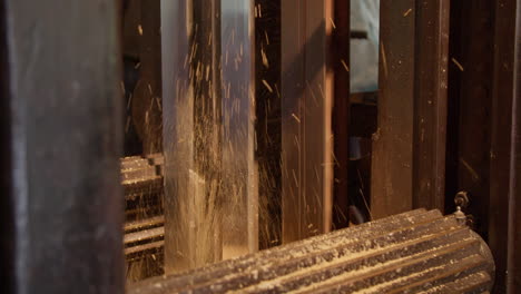 close-up of saw blades cutting wood in a sawmill