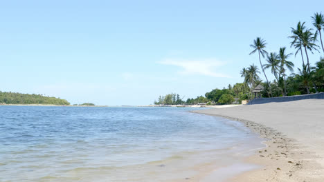 Beautiful-nature-with-landscape-of-sea-beach-and-coconut-palm-tree-on-blue-sky-in-Samui-island-Thailand