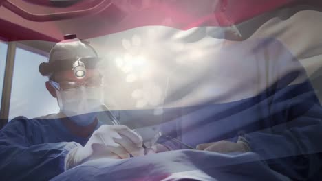수술실에서 외과 의사 들 위 에 흔들리는 네덜란드 의  ⁇ 발 의 애니메이션