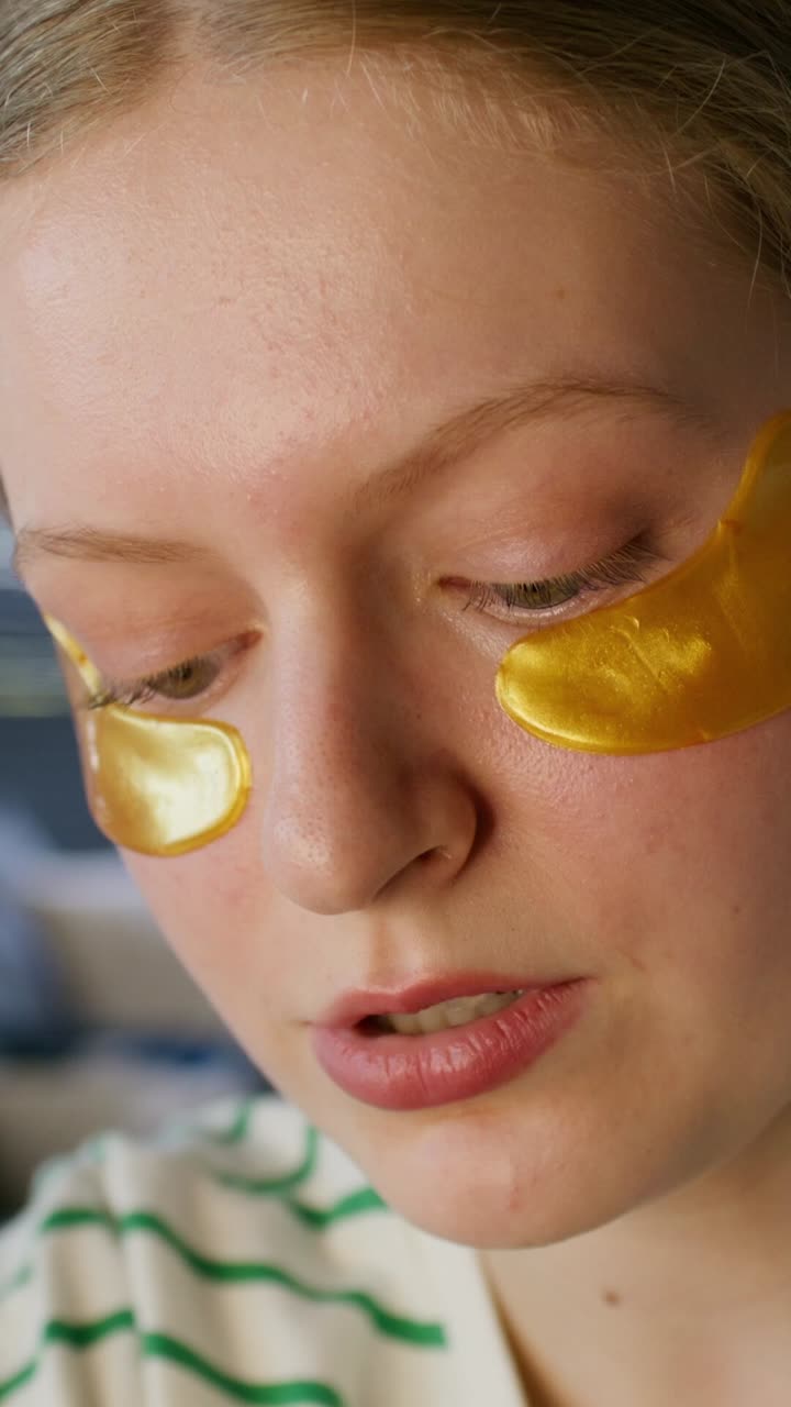 Woman with gold eye patches