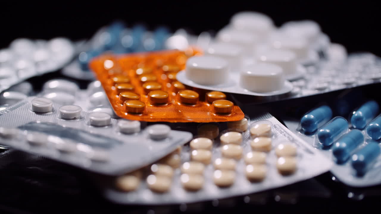 Various Medical Pills Drugs Black Background Pharmaceutical Industry Painkillers Rotating 9