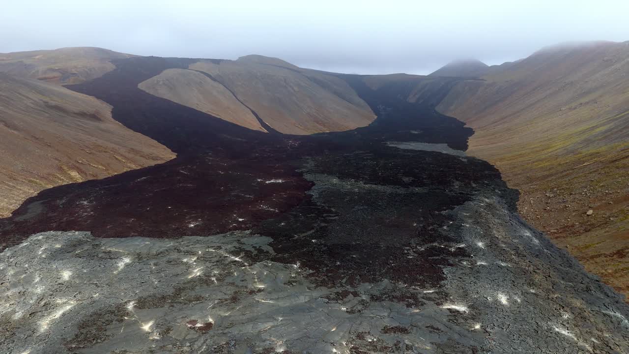 aerial wide angle valley view of rocks formation solidified lava in Langihryggur Iceland active volcano