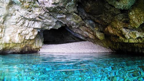 sea cave in a beautiful beach, kefalonia, greece - wide shot