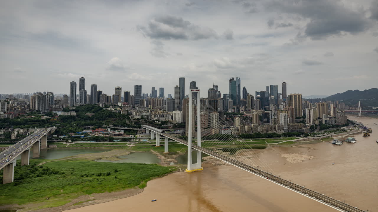 Timelapse of the amazing Chongqing cyberpunk city skyline from a high vantage point wirh the yangtze river