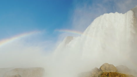 niagara falls water cascades to rocks below