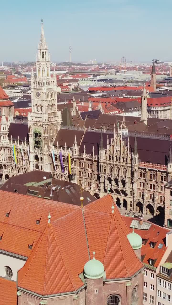 Main Facade Of New Town Hall Building From St. Peter Catholic Church In Munich, Germany. - aerial vertical shot