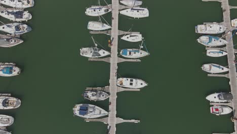 4k birdseye view drone shot of marina of sailing boats