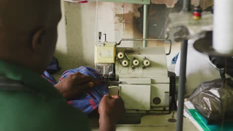 african man sewing tissue