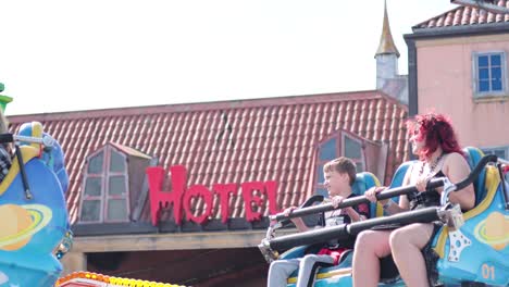 people enjoying a thrilling amusement park ride