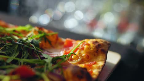 close up shot of a german flat bread pizza with arugula tomatoes and bread salad stone oven fresh baked 25 fps slowmotion