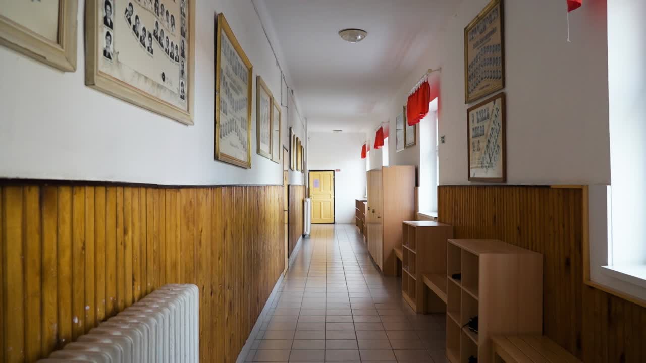 School hallway with old photos on the walls