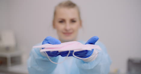 woman holding protective mask in hands 4