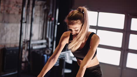 Slow-Motion-Of-Confident-Young-Woman-Doing-Cardio-On-Stationary-Bike