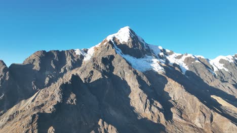 Flying-view-of-the-mountains,-snow-capped-La-Veronica,-Sacred-Valley,-Cusco