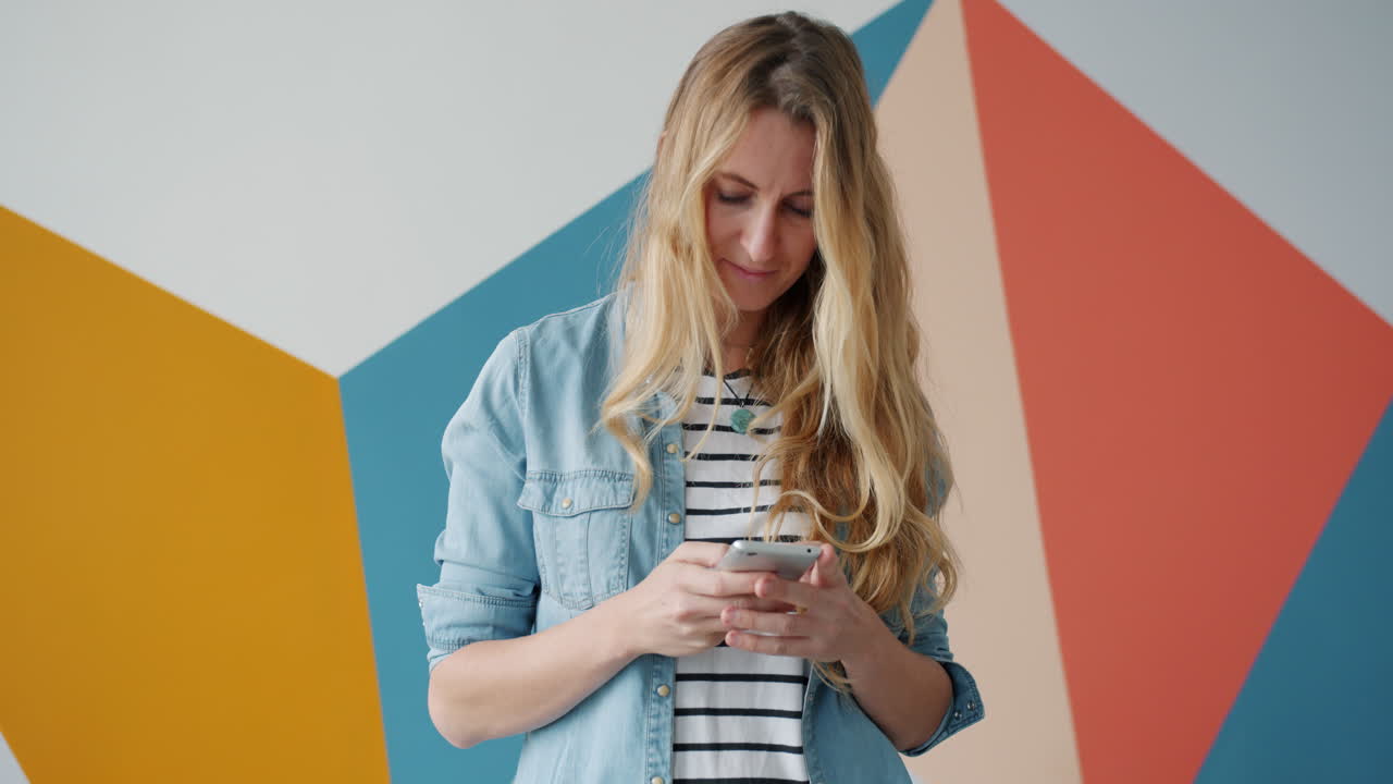 Woman using smartphone in a modern interior