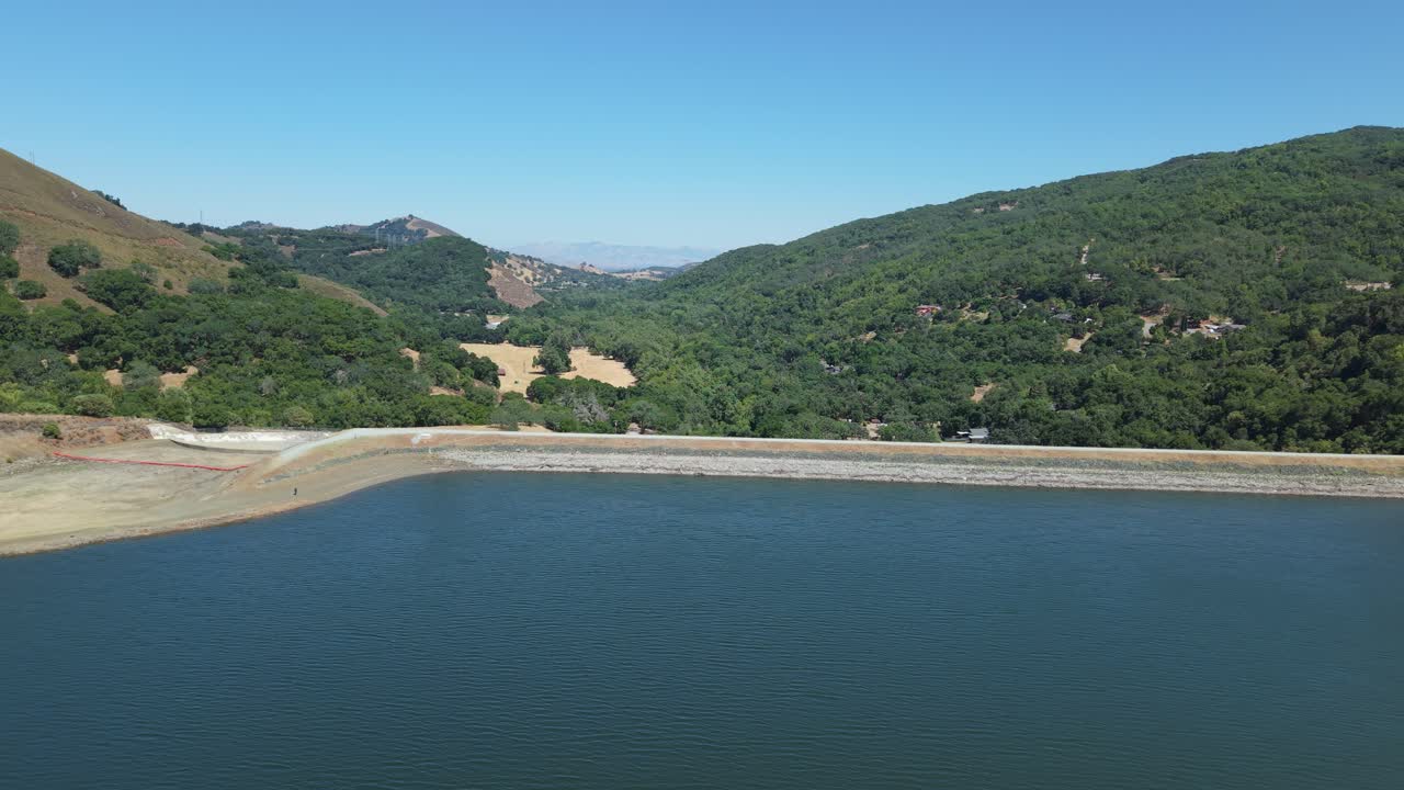 Hills meet water in a flowing aerial panorama of Uvas Reservoir, highlighting California’s subtle terrain