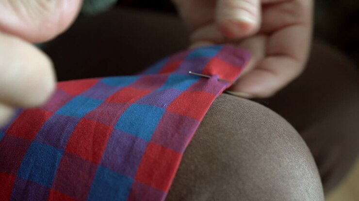 Measuring and preparing cloth for cutting it and sew it into a protective mask for mouth and nose