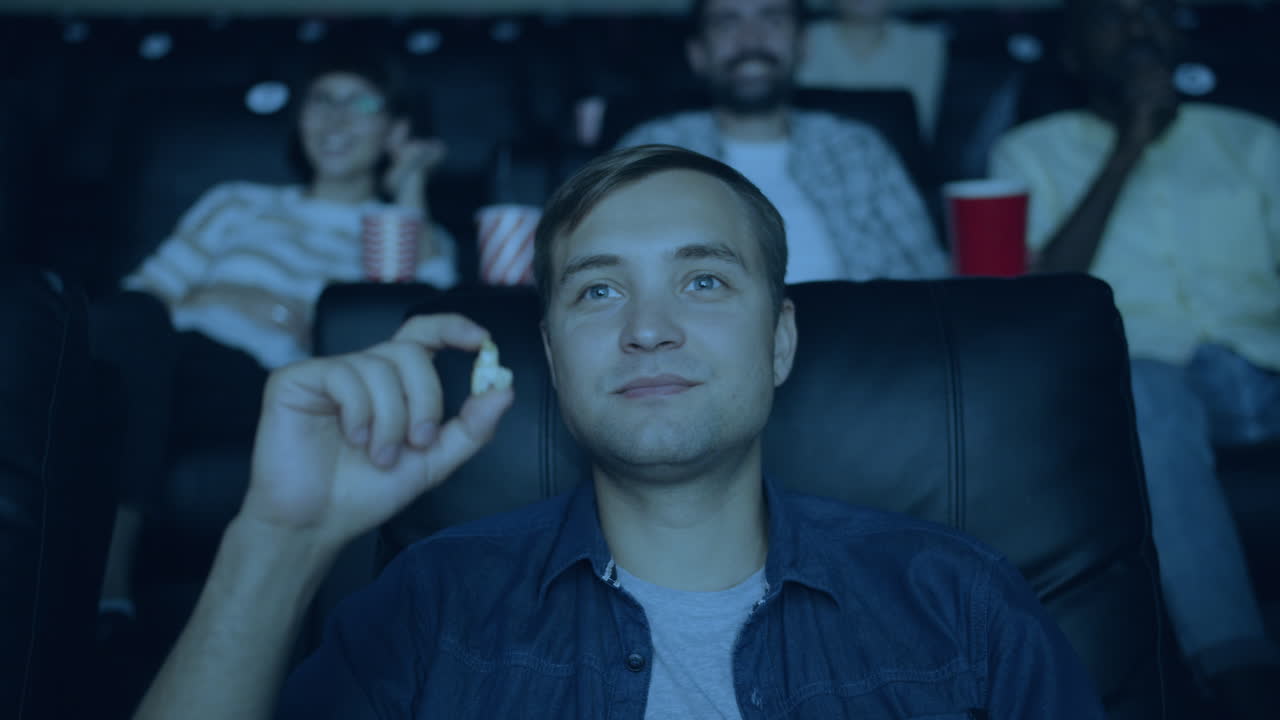 Man Watching Movie in a Theater