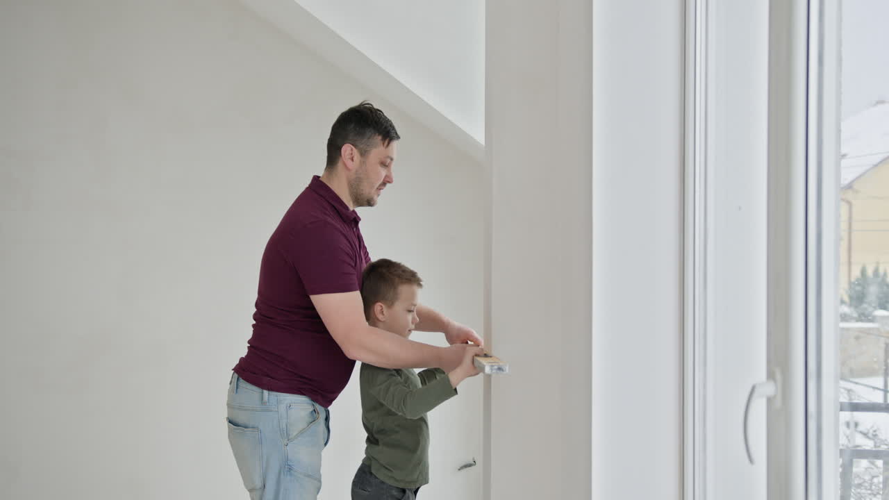 Father and son working together on home improvement project
