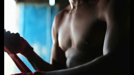 african american male boxer wearing hand wrap in fitness studio 4k