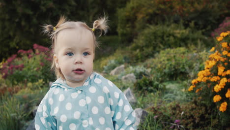 Cute-little-girl-walking-in-the-park,-walking-towards-the-camera