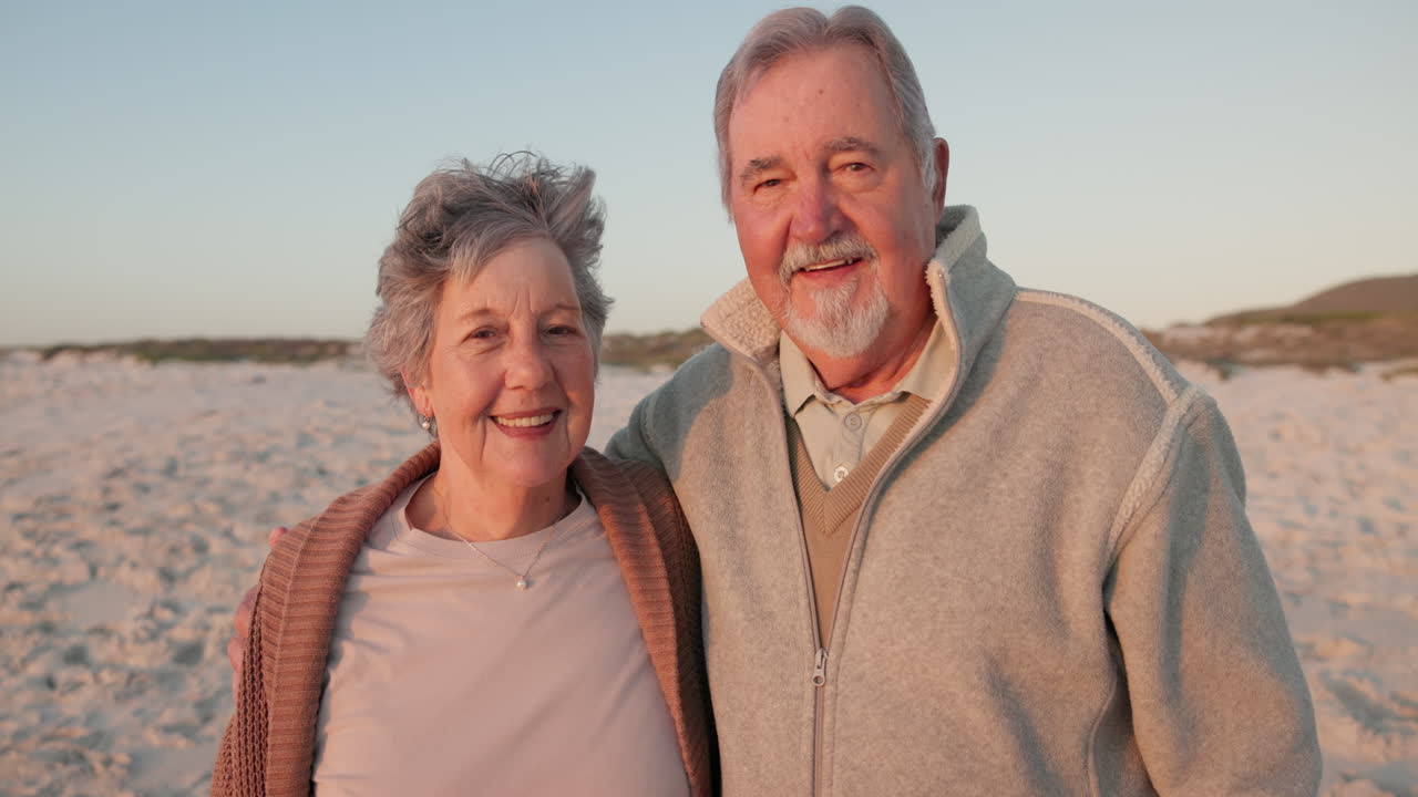 Hug, beach and face of senior couple by ocean