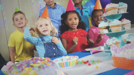 taking photos of children at birthday party on a digital camera